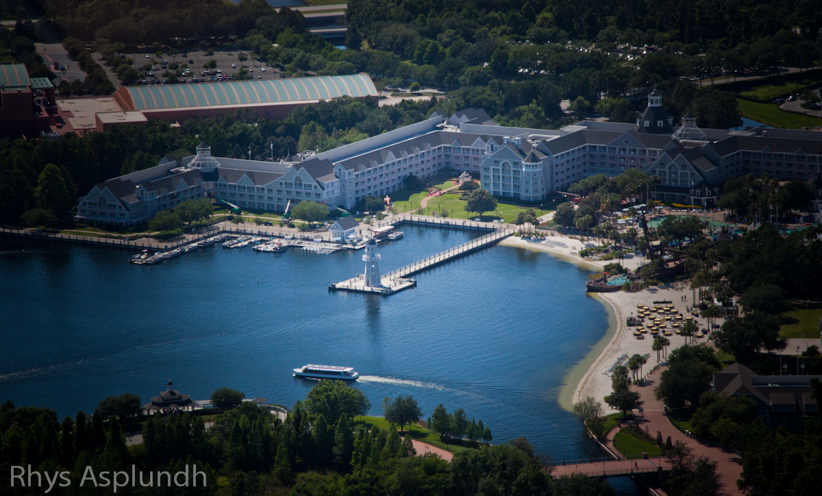 Aerial view of Disney's Yacht Club Resort, showcasing its waterfront location, marina, and resort buildings.