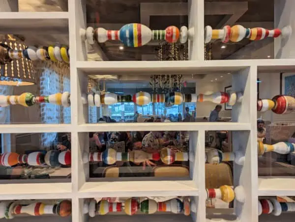 Colorful decorative spindle screen looking into Sebastian's Bistro dining room