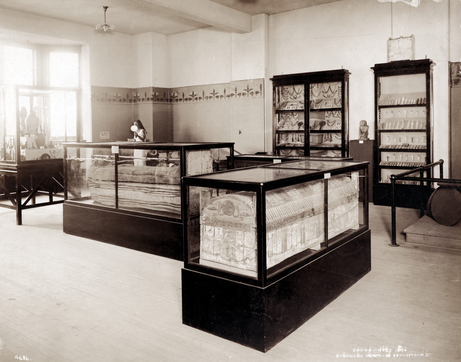 An Egyptian exhibit showing a mummy and other artifacts at the Department of Anthropology, 1904 World's Fair, St. Louis