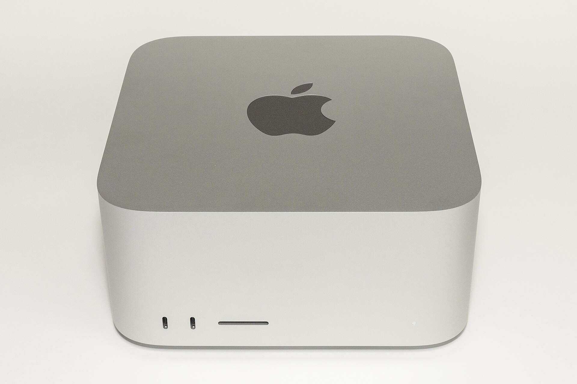Front view of a silver Mac Studio (2022 model year), compact aluminum enclosure