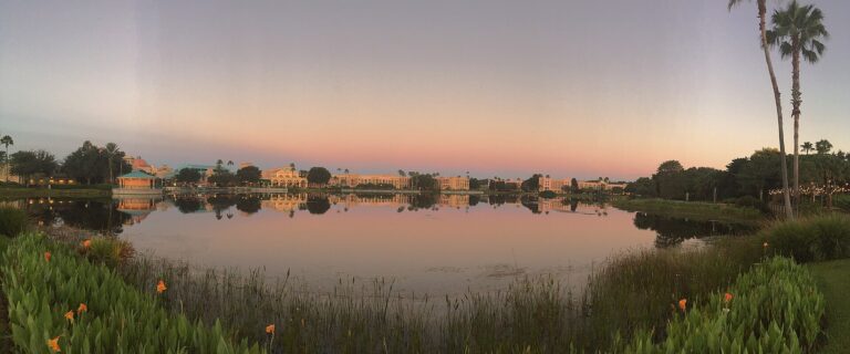 Early morning view of Disney's Coronado Springs Resort along the manmade lake Lago Dorado