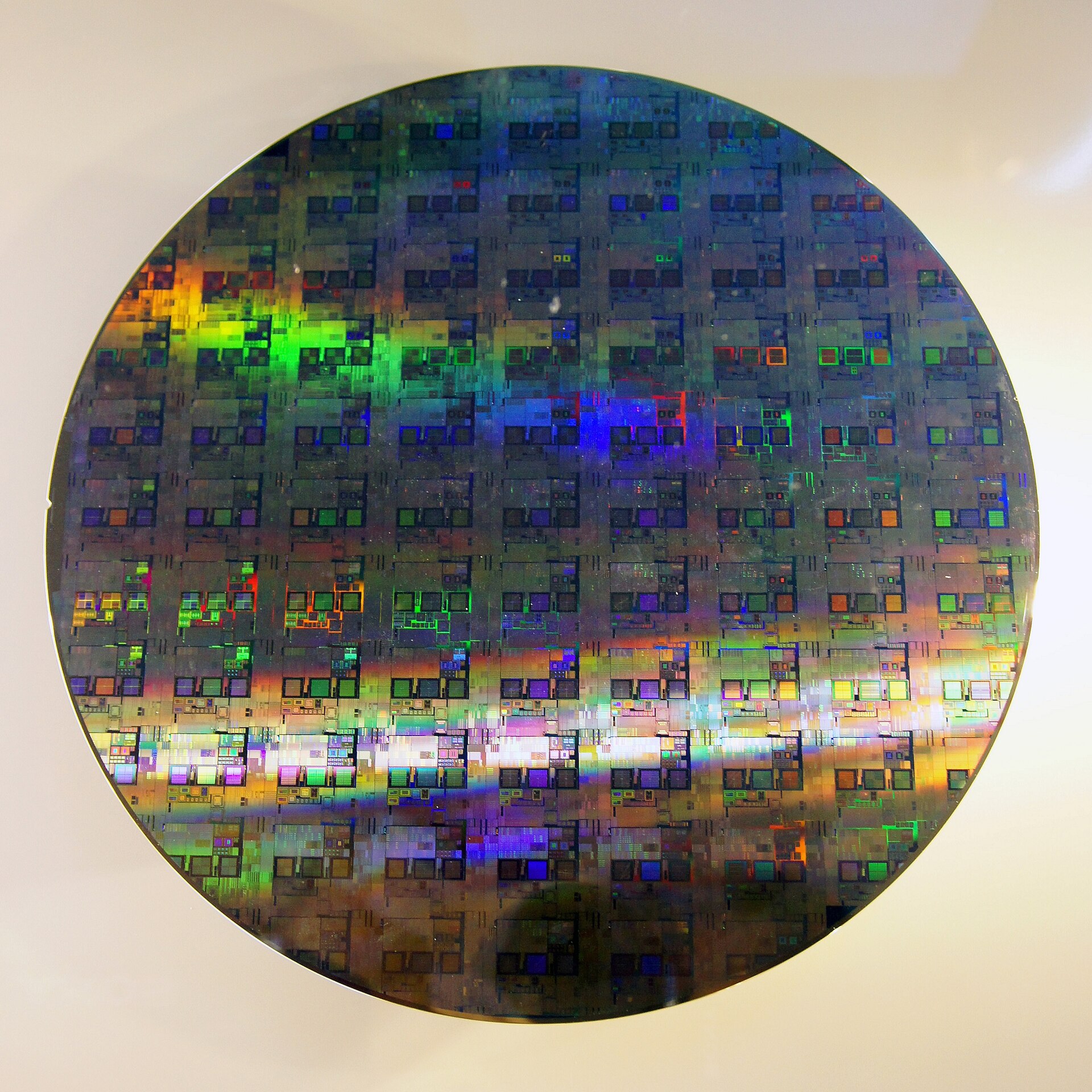 A 12-inch silicon wafer showing completed semiconductor dies