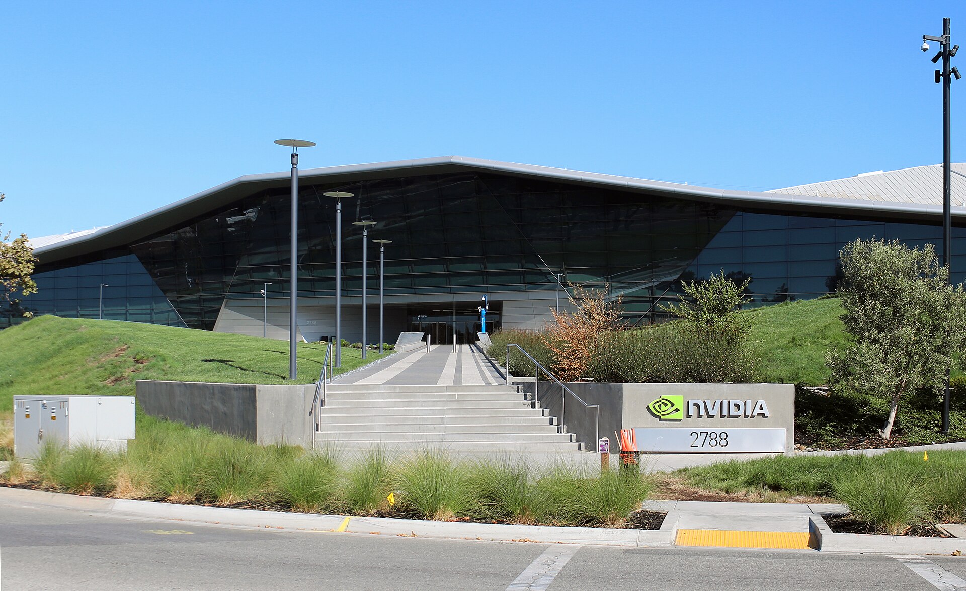 The NVIDIA corporate headquarters campus in Santa Clara, California, with the NVIDIA logo sign at the entrance to the building