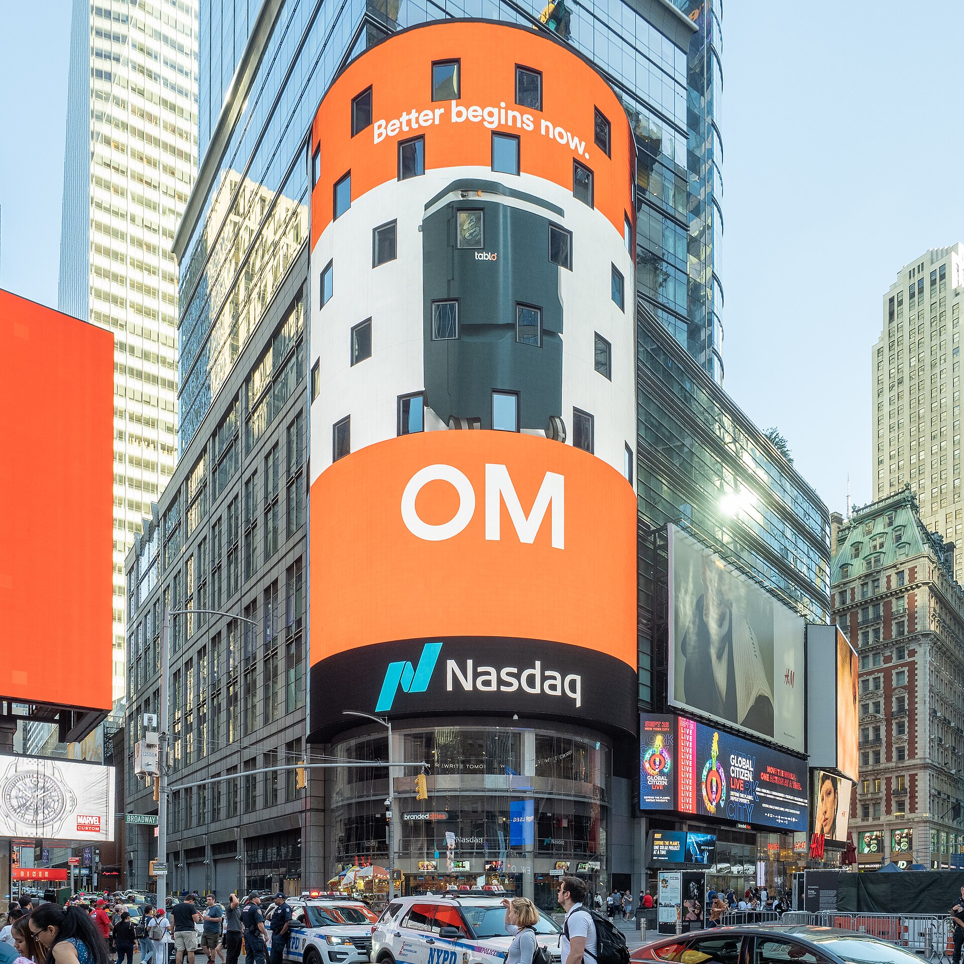 The Nasdaq MarketSite tower in Times Square, New York, with its curved electronic display above the street